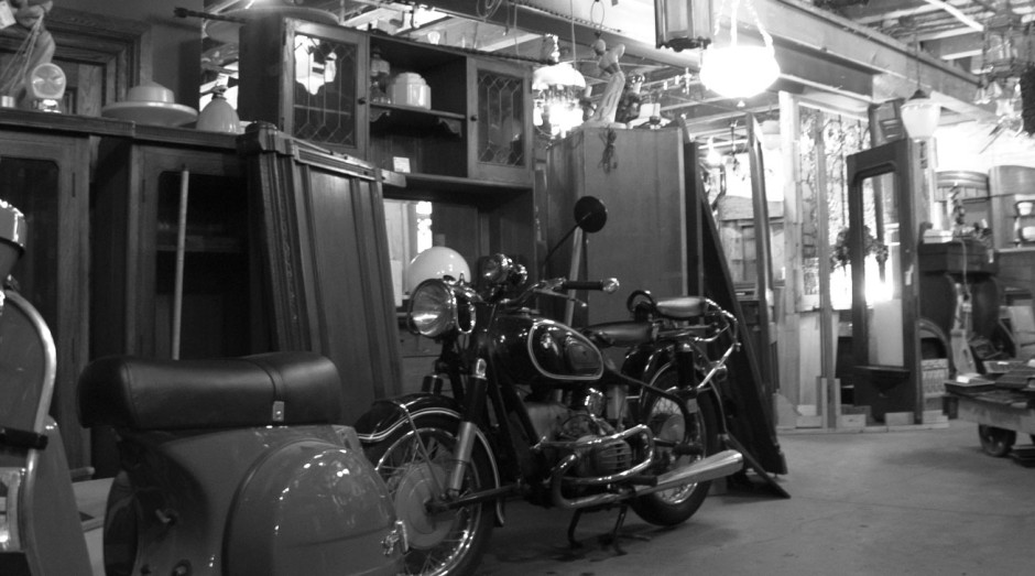 City Salvage showroom—vintage scooter and motorcycle.